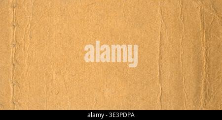 Brown kraft paper texture showing visible fibers, natural wrinkles and warm rustic vintage surface Stock Photo