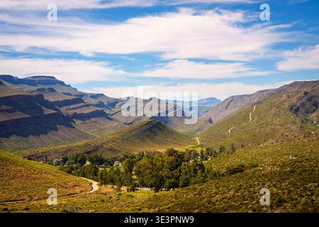 Majestic Cederberg Mountains tower over historic Wupperthal hamlet in South Africa's Western Cape a serene mission village amongst dramatic rocky peak Stock Photo