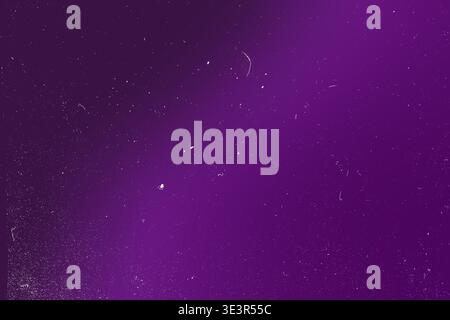 Vibrant purple gradient background with subtle dust particles and grain noise overlay, soft blurred texture, horizontal banner with central copy space Stock Photo