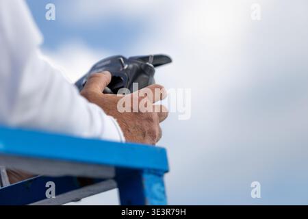 Older Person Using Remote Interface Controller Stock Photo