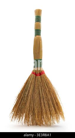 vintage broom closeup on white isolated background Stock Photo