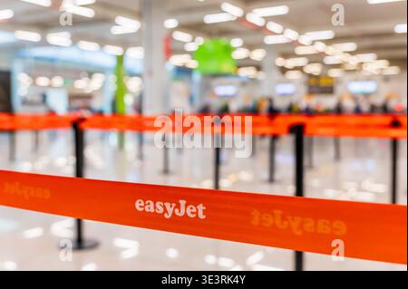 MALLORCA, SPAIN - APRIL 19, 2025: EasyJet Check-In Queue with Passengers at Airport Terminal in Spain. Stock Photo