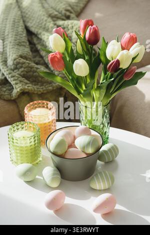 Living Room Decorated Easter Eggs , Candles and Tulips. Cozy Spring Holiday Arrangement Stock Photo