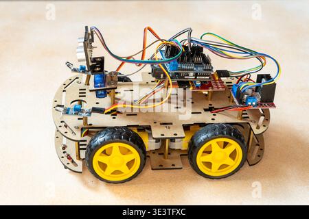 Arduino DIY robotic car kit with ultrasonic sensor, controller. Educational electronics project for STEM learning robotics. Robot Assembly With Electronic Components. Kyiv, Ukraine - March 18, 2026 Stock Photo