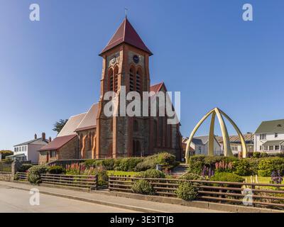 Christ Church Cathedral, Ross Road, Stanley, Falkland Islands. On a sunny morning. The whalebone arch is made from the jawbones of two blue whales. Stock Photo