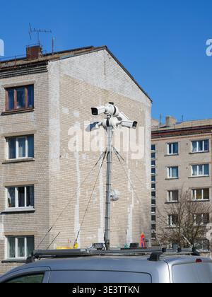 Security camera system installed on a vehicle for mobile surveillance, monitoring urban streets and residential buildings Stock Photo