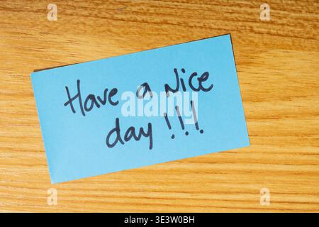 Sticky note or yellow note with the word "think positive" written on it Stock Photo