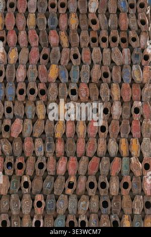 Rusty metal scaffolding components arranged in repeating pattern. Industrial texture background  Stock Photo