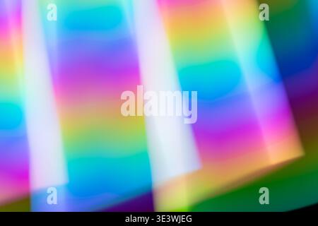 Vibrant neon abstract background featuring flowing, colorful hues blending seamlessly into one another, creating a dynamic and mesmerizing visual expe Stock Photo