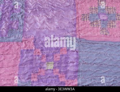 Textile background stitched silk pieces in patchwork scarf Stock Photo