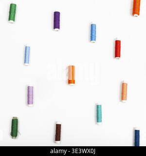 Several rolls of sewing thread on white background Stock Photo