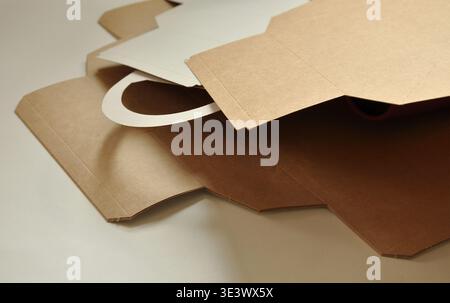 Cardboard brown boxes, unfolded, layered. Abstract artistic background. Sustainable packaging concept, packaging template, wood, paper industry Stock Photo