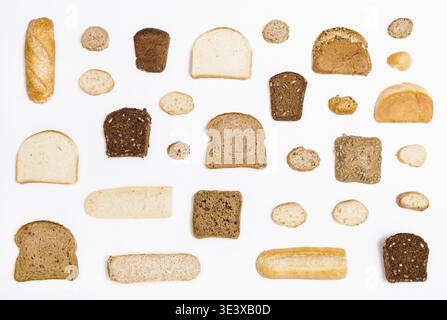 Various sliced breads and rolls on white background Stock Photo