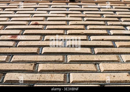 Construction background view of the wall from below made of end bricks Stock Photo