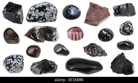 Set of various obsidian (volcanic glass) natural mineral gemstones and samples of rock against a white background Stock Photo