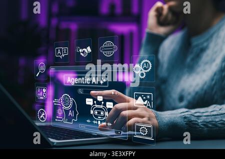 Agentic AI technology concept. Person using laptop with artificial intelligence interface of robot assistant, data processing, and smart automation Stock Photo