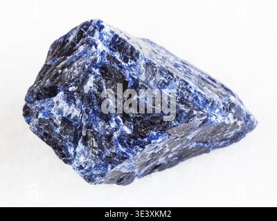 Macro shot of natural rock samples of raw sodalite gemstone on white marble background Stock Photo