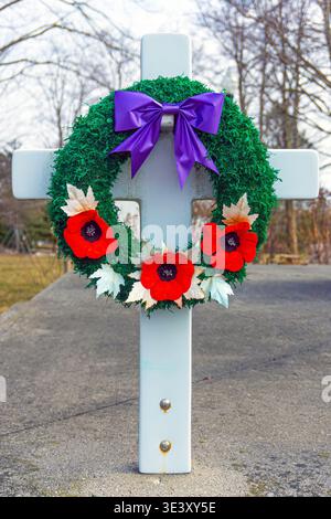 Rememberance Day Wreath featuring iconic red poppies at the cenotaph in Seaforth Ontario.  Marcg 24, 2026. Stock Photo