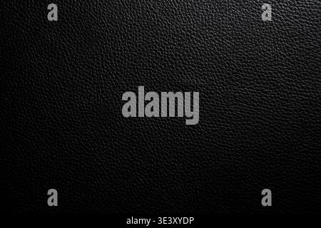 Premium black pebbled leather texture. Sleek background for luxury branding, automotive interiors, and high-end tech product UI/UX design Stock Photo