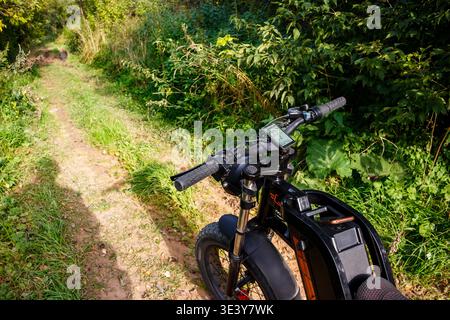 Modern electric fat bike ready for a rugged trail adventure, blending technology with nature's serene beauty. Journey into the wild, embrace eco-frien Stock Photo