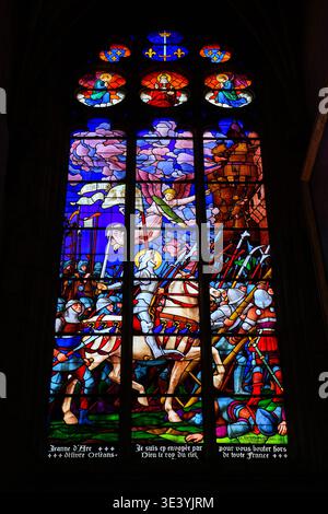 Joan of Arc stained glass window in the Saint-Etienne Cathedral of Auxerre in Burgundy, France Stock Photo