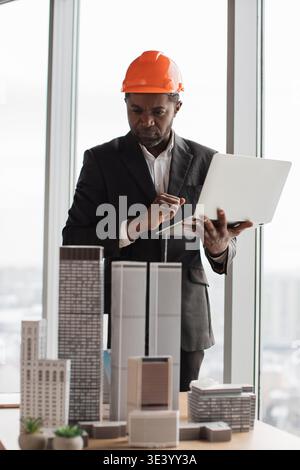 Architect Reviews Building Models Stock Photo