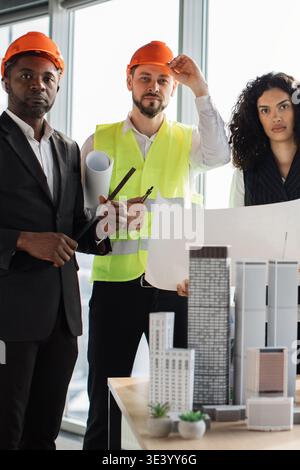 Architects Reviewing Building Plans Stock Photo