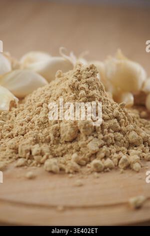 Ground ginger and garlic on wooden kitchen surface Stock Photo