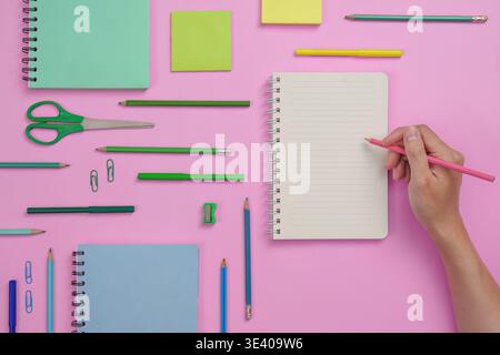 Back to school supplies arranged on pink background Stock Photo