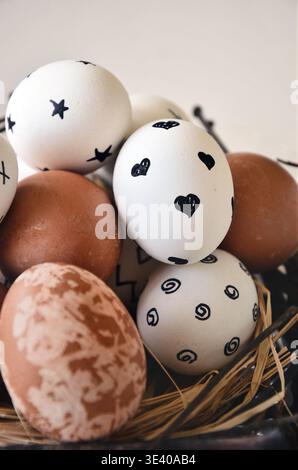 Easter eggs in a twig nest natural minimalist closeup Stock Photo
