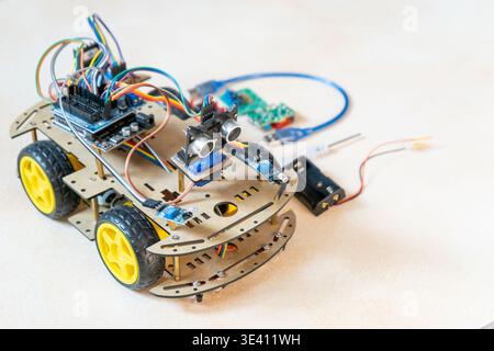 DIY Robot Car Assembly and Components. Educational electronics project for STEM learning and robotics. Stock Photo