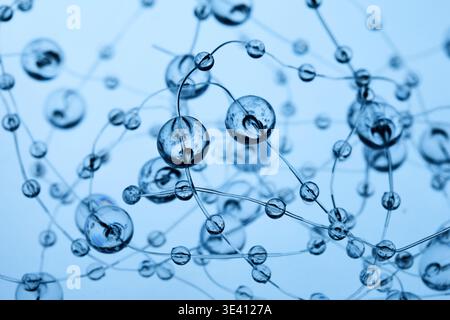 Transparent spheres forming abstract network connection blue background Stock Photo