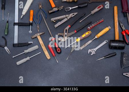 Various Hand Tools Background. Professional DIY Equipment for household. Assorted work and home renovation tool flat lay. Stock Photo