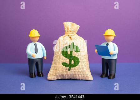 Engineers and a dollar bill. Project budget. Financial planning supports engineering decisions. Cost estimation and resource allocation ensure project Stock Photo