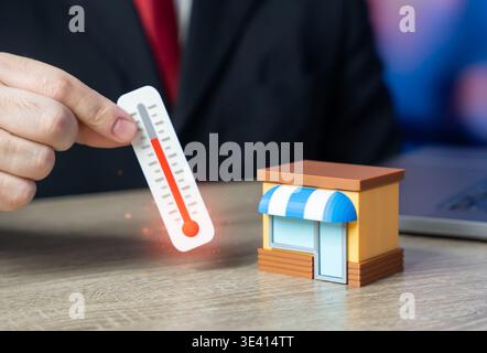 A man taking the temperature of a business. Investment climate and acceptable business conditions. Understanding store problems and optimizing busines Stock Photo