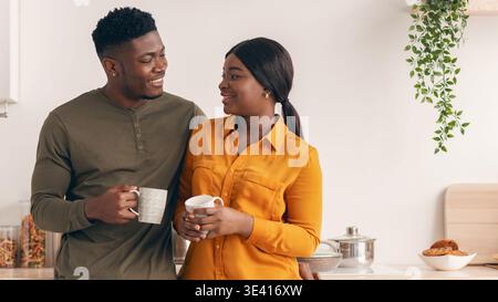 Romantic Young African American Couple Drinking Tea In Kitchen Together Stock Photo
