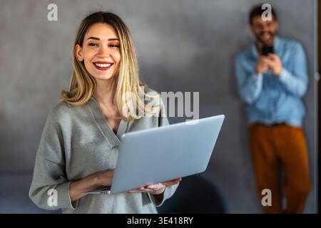 Woman working on laptop online, checking emails and planning on the internet at home office Stock Photo