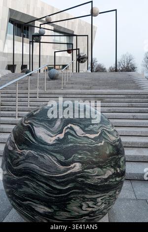 Detailed view of natural stone sphere with swirling green pattern from Preposition 2023 by Alicja Kwade at AMA Stock Photo