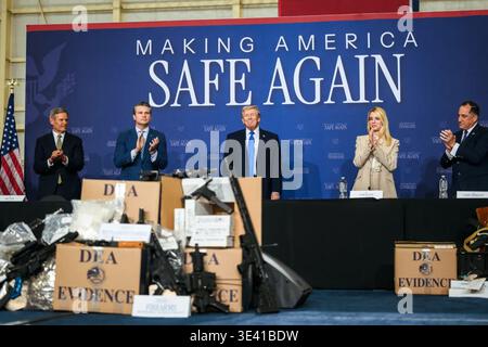 President Donald J. Trump stands with officials during a public safety roundtable at the Tennessee Air National Guard Base in Memphis, Tennessee, March 23, 2026, with seized weapons and DEA evidence displayed in the foreground. Image courtesy of the White House. Stock Photo