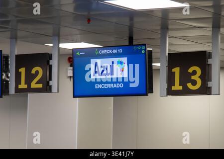 Closed airport check-in counter with an Azul Airlines electronic display. Stock Photo