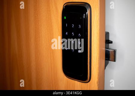 Electronic numerical lock installed on the door. Stock Photo