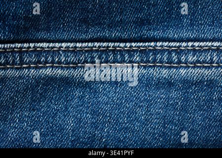 Detailed blue denim fabric texture background with visible stitching pattern Stock Photo