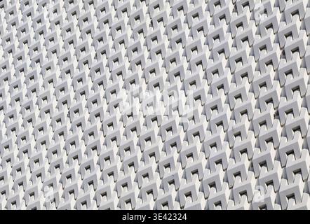 Artistic grey white 3D pattern of modern building facade in the sunlight Stock Photo