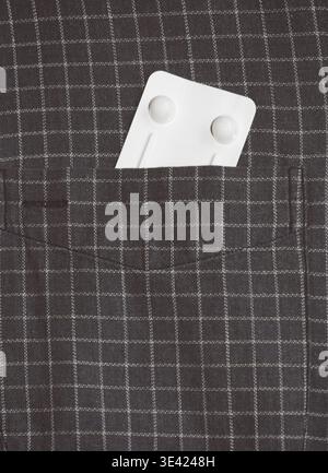 medicine blister in the shirt pocket Stock Photo