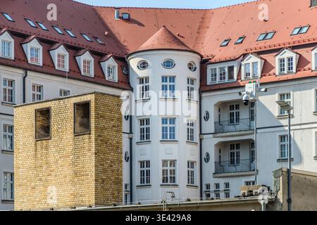 Close-up of the distinctive circular façade of the former Stasi building at Dittrichring 24, Leipzig (Museum in the Round Corner memorial): an Art Nouveau building with a cylindrical bay window and oval windows; a modern surveillance camera is mounted on the façade. Leipzig, Saxony, Germany Stock Photo