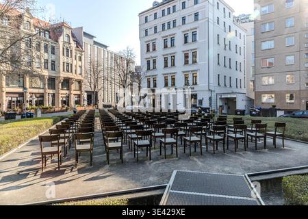 Synagogue memorial: rows of chairs in the open air on the event site; front view: a view down the street lined with Wilhelminian-style and post-war buildings; rows of chairs set up in a stage-like formation. Leipzig, Saxony, Germany Stock Photo