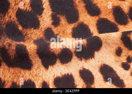 Leopard print fabric texture background close up Stock Photo