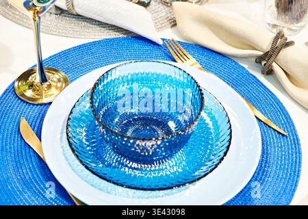 Blue glass plates on the festive table Stock Photo