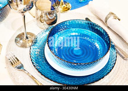 Blue glass plates on the festive table Stock Photo