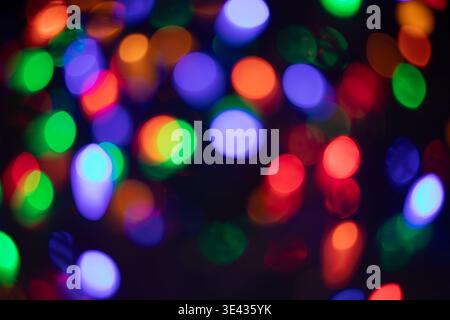 Colorful blurred lights create magical, festive atmosphere Stock Photo